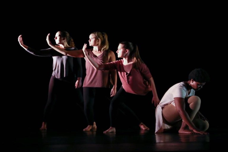 Four student dancers performing.