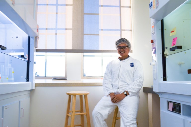 Student researcher in a lab.